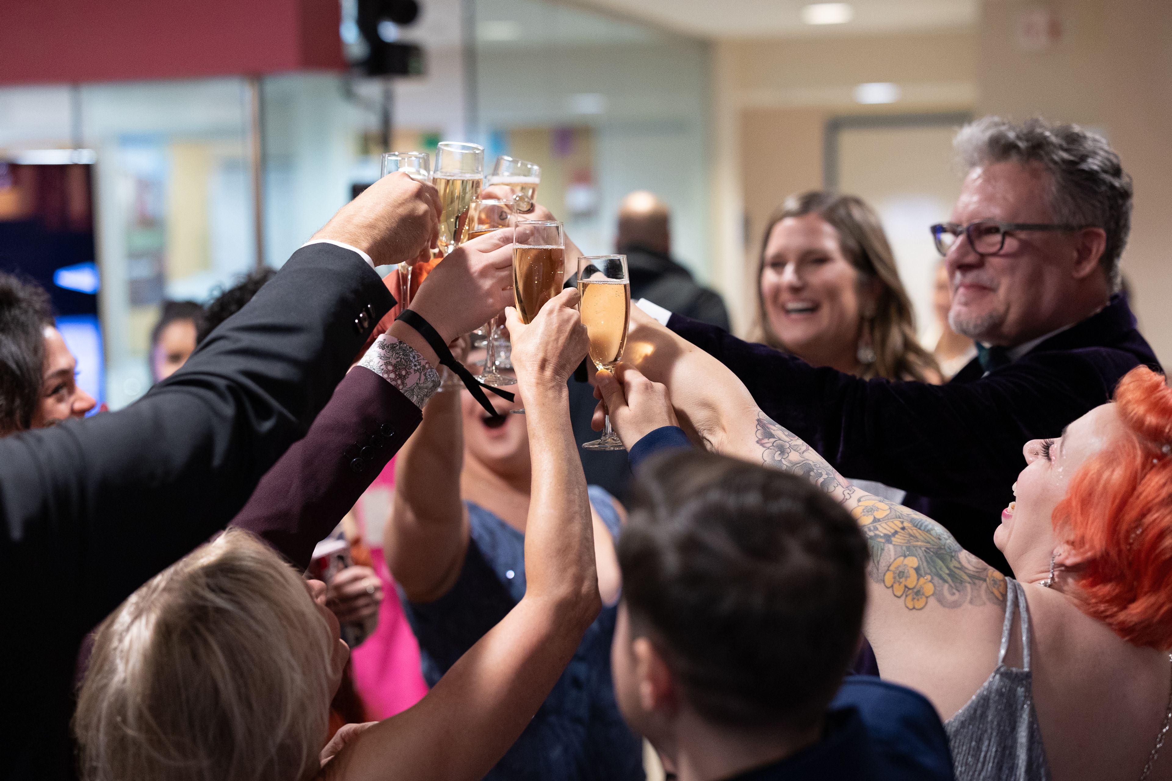 Group of people giving a Champagne toast