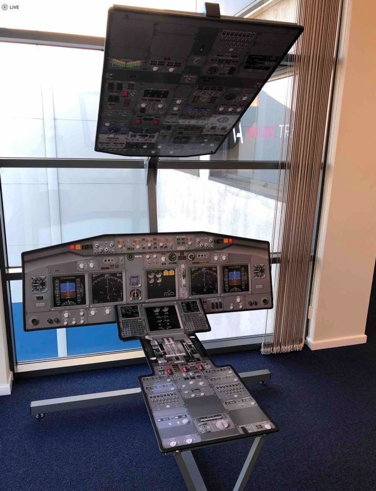 Practising 737 flows on a printed cockpit poster