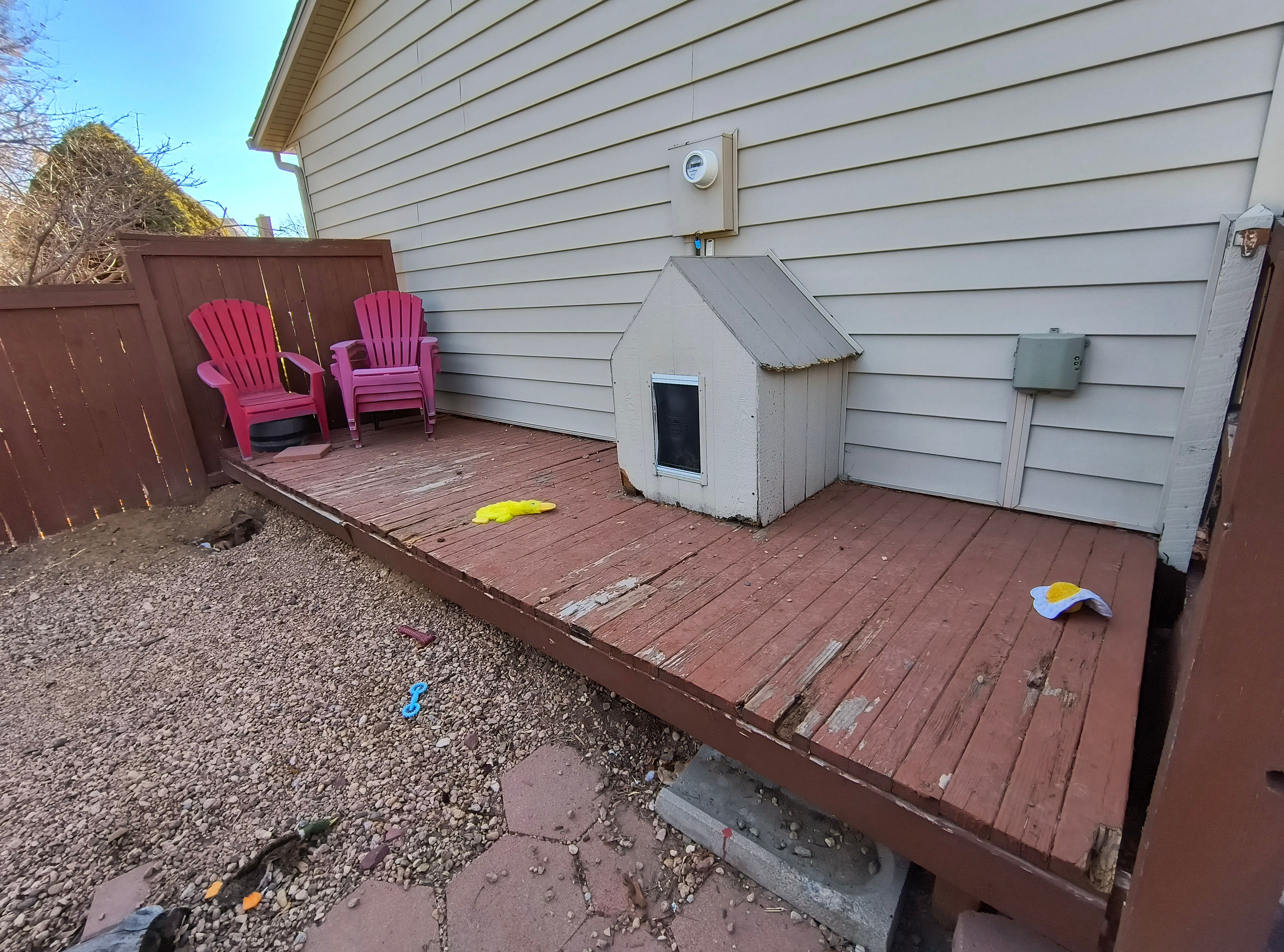 Before: worn deck and dog house