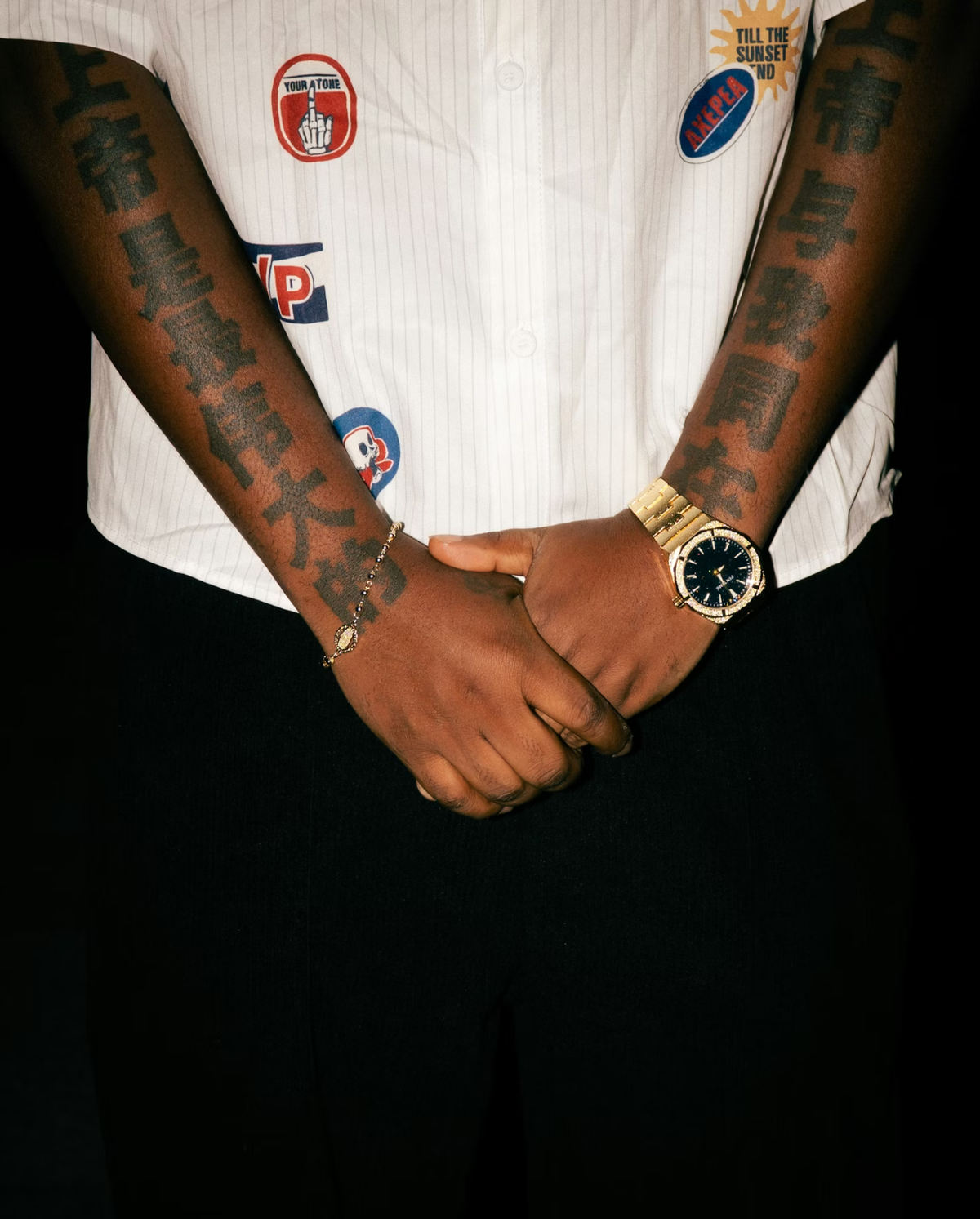 Tatooed man with a gold watch