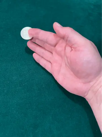 thumb palm coin vanish