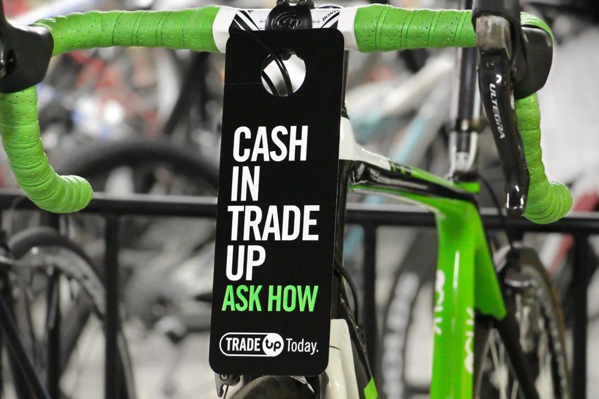 Bike with a tag that says, "Cash In Trade Up, Ask How"