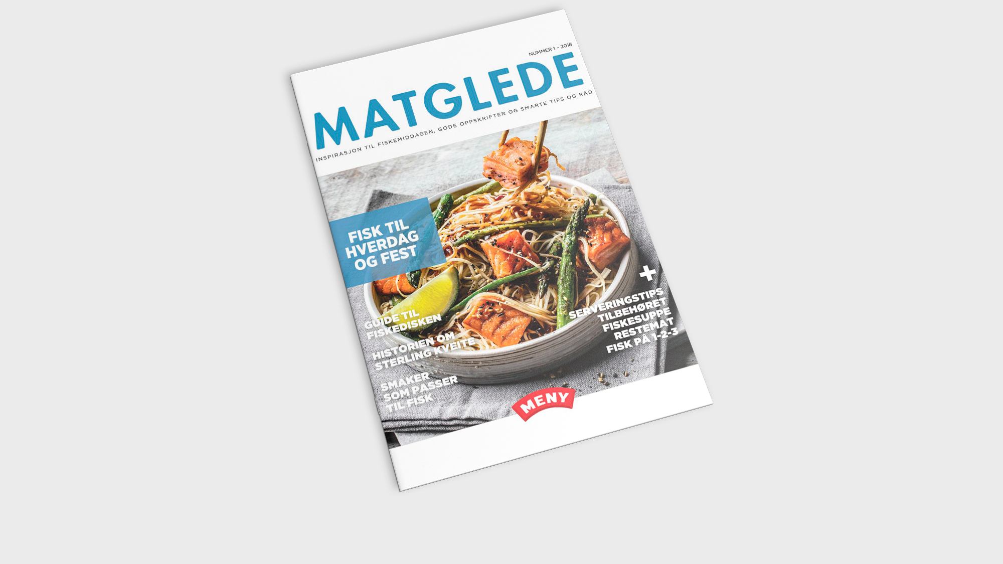 Forside av et matmagasin med bilder av sjømat og sitron på en tallerken.