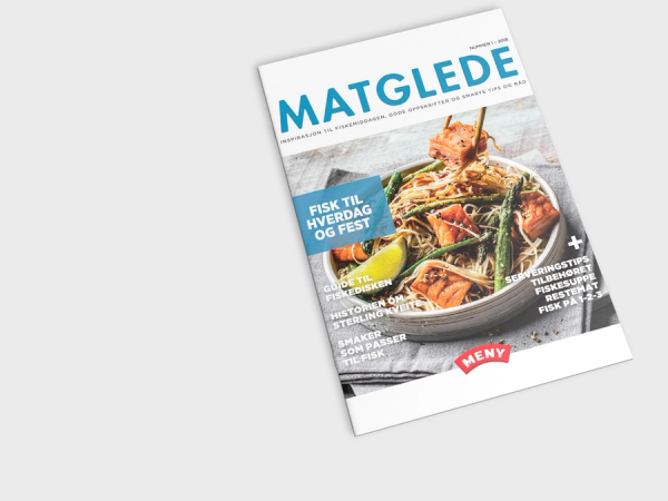 Forside av et matmagasin med bilder av sjømat og sitron på en tallerken.