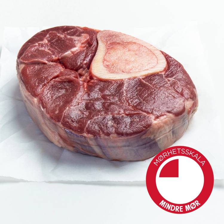 En rå Angus-kjøttknoke med bein, pakket på en hvit overflate, med en Norskj symbol for mindre melk i hjørnet.