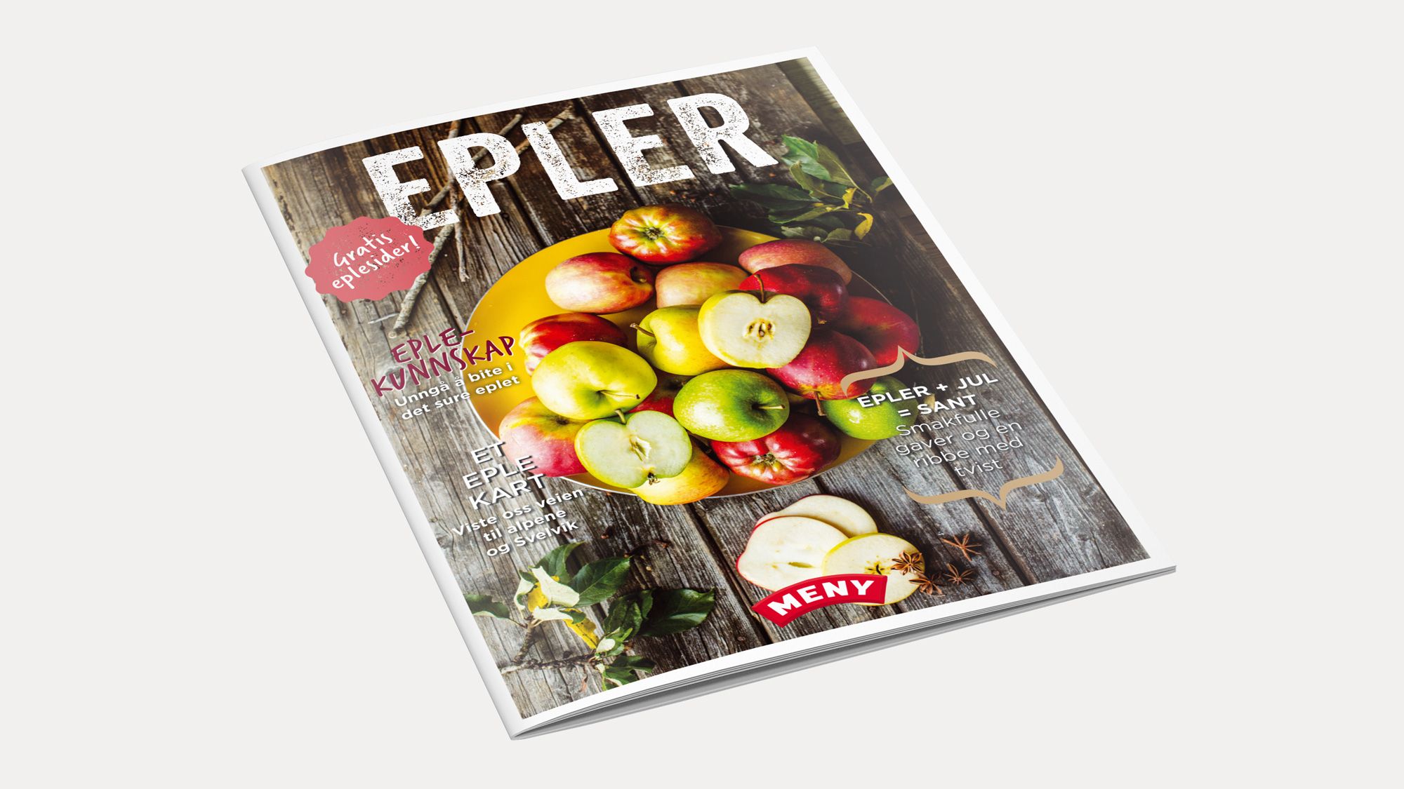 En magasinmockup med bilder av epler på forsiden, med teksten 'EPPLER' og en rød prislapp.