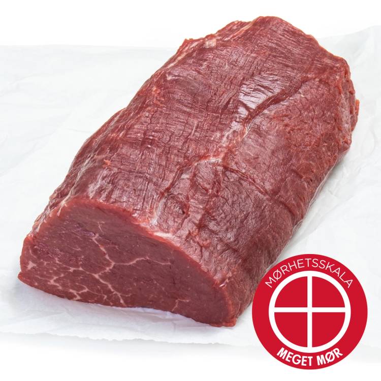 Angus indrefilet av stor, rå kjøttstykke med tydelige muskelfibre og en mørk rød farge, plassert på hvitt papir med Mørhetsskala-merke i hjørnet.
