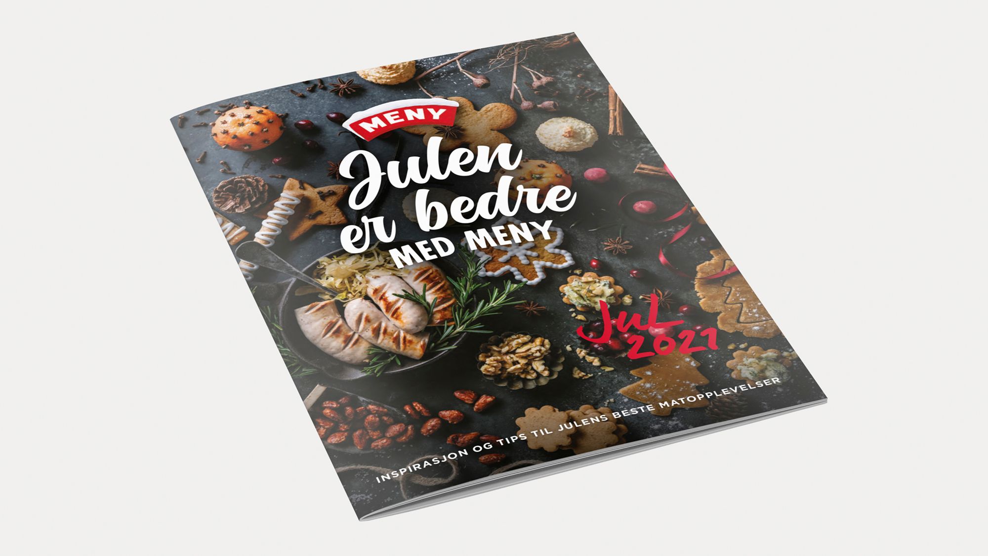 En julemat- og bakebok med tittelen 'Jule og bedre med Meny' og juledekorasjoner på forsiden.