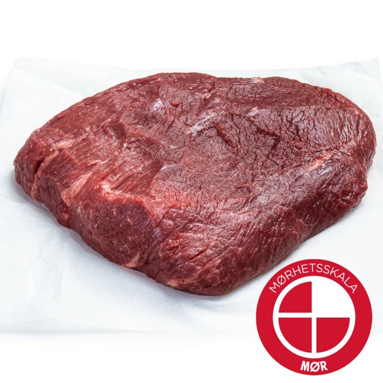 En rå Angus-idenver steak på hvitt papir, med Mørhets-skalaen Mørk logo i hjørnet.