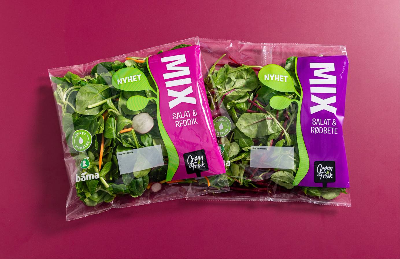 To poser med salatposer med grønt bladgrønt, merket med 'NYHET' og 'SALAT & REMOBTE', på en rosa bakgrunn.