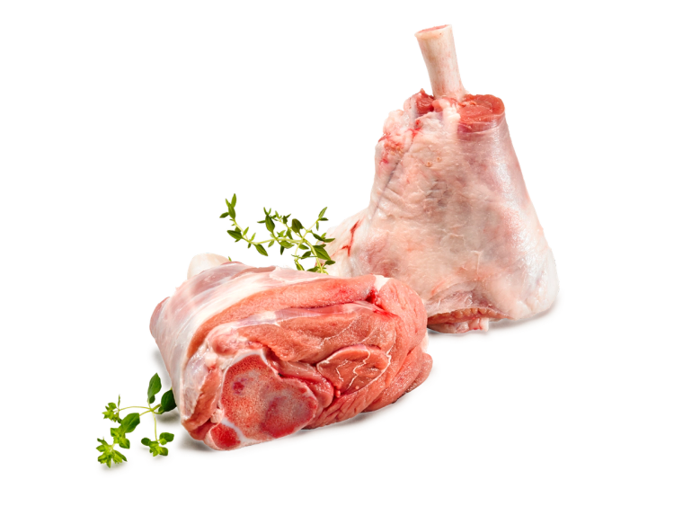 To lammeskanker, en med bein og en uten, plassert på et hvitt underlag med noen grønne urter ved siden av.