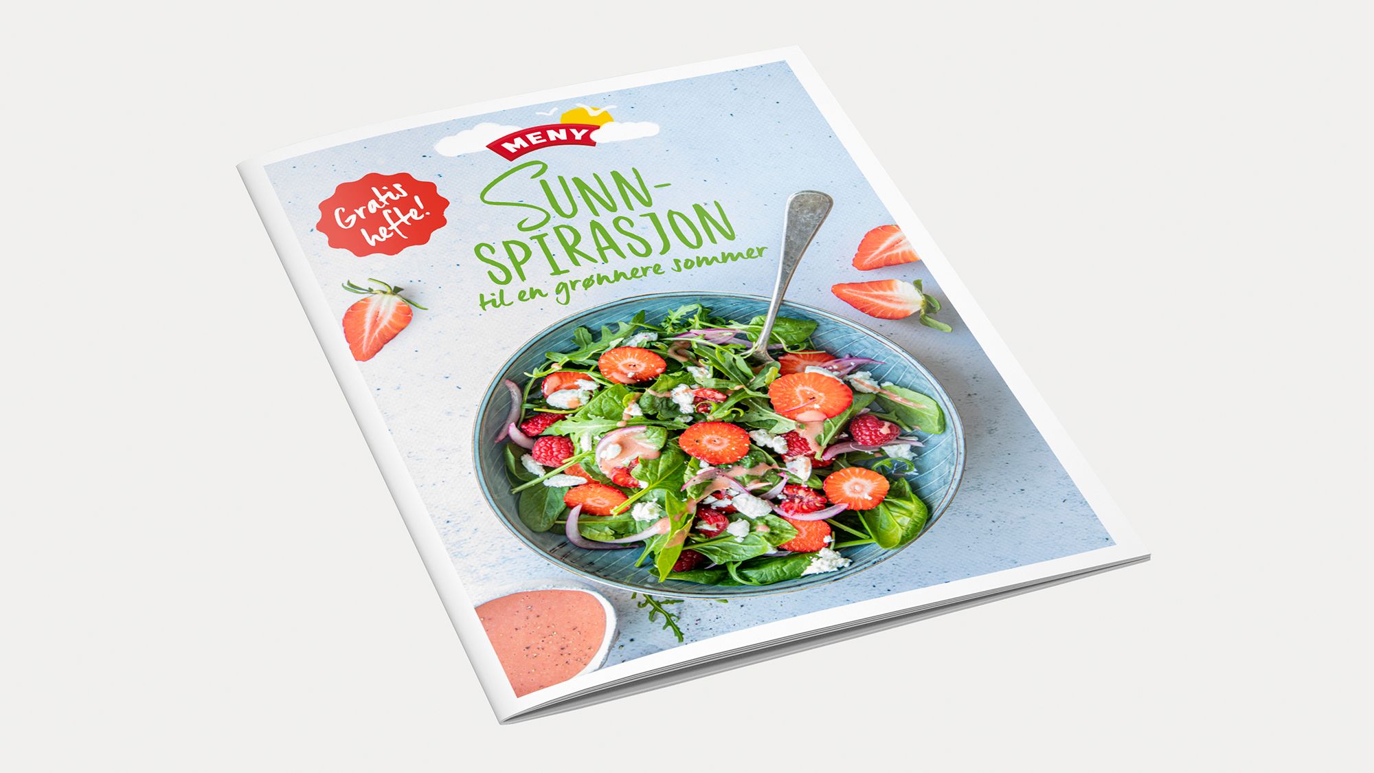 Forside av et sommermagasin med en salat i en bolle og teksten 'Sunn Spirasjon' på forsiden