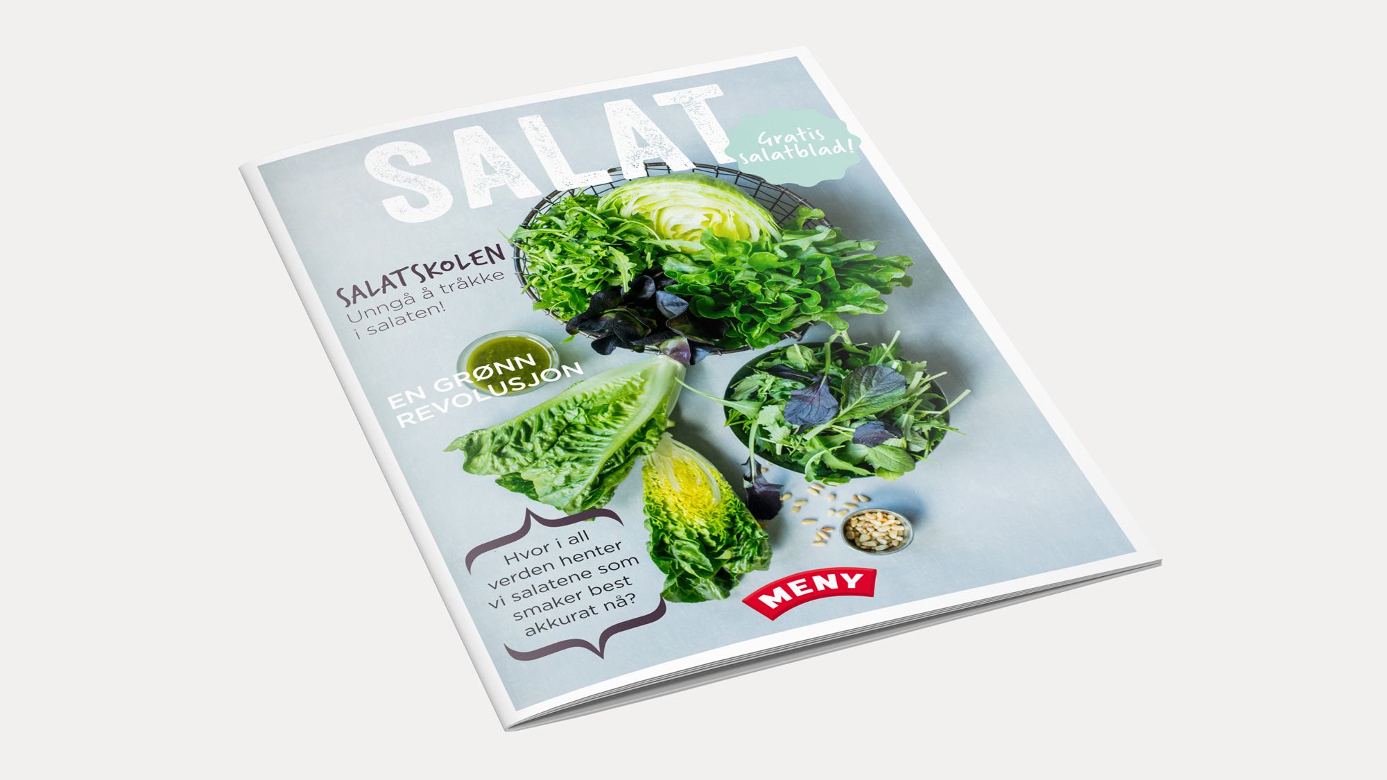 En magasinmockup med bilder av ulike salat- og grønnsaksbilder på forsiden, inkludert salatblader og sitron.