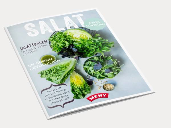 En magasinmockup med bilder av ulike salat- og grønnsaksbilder på forsiden, inkludert salatblader og sitron.