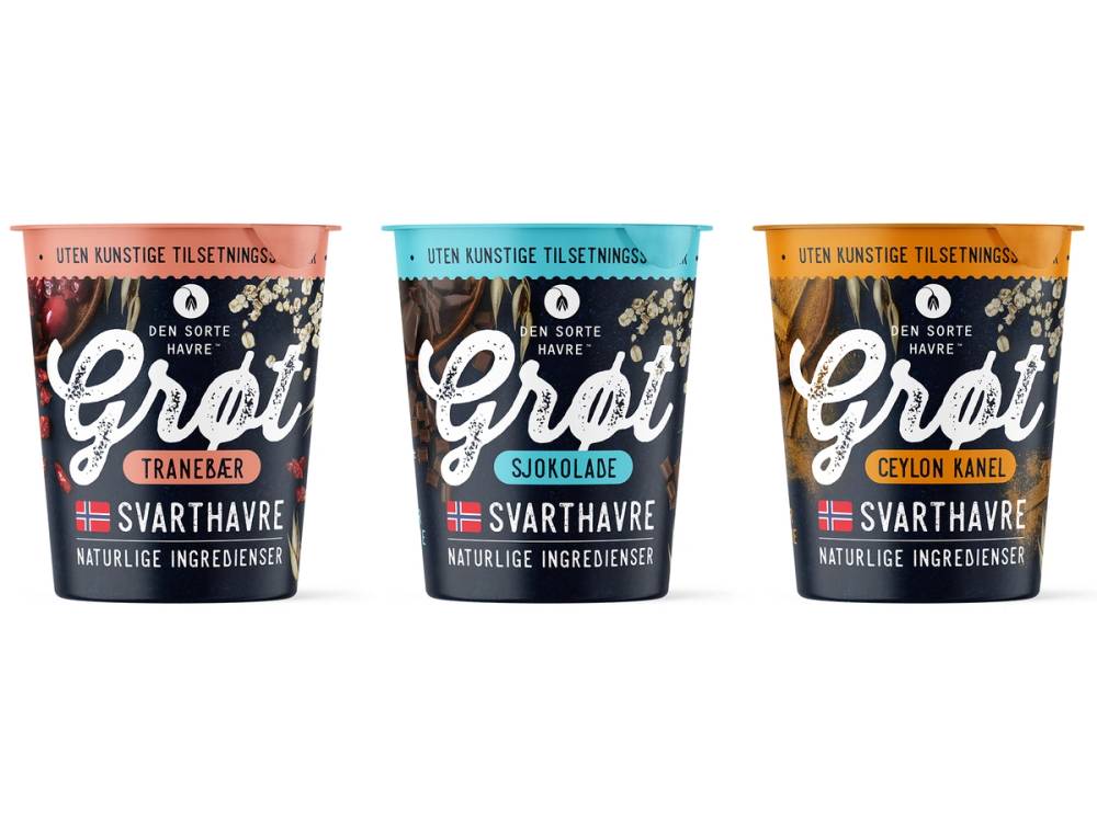 Tre pakker med grøt i ulike smaker: tranebær, sjokolade og kanel, alle med svart havre og naturlige ingredienser.