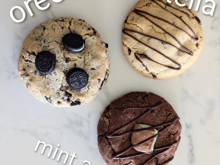Three giant cookies, an Oreo one, a Nutella one and a mint one, on a marble board, from Simply Homemade by Kim in Bracknell
