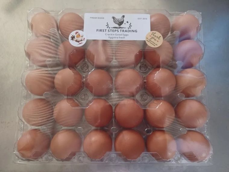 A tray of fresh brown eggs from First Steps Trading in Strathalbyn, with their Crackin Good Eggs label