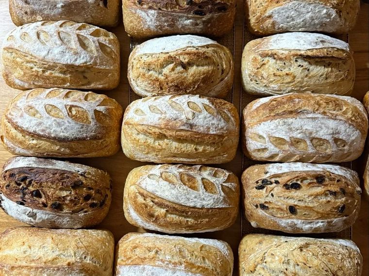 Rows of freshly baked, hand-scored sourdough loaves cooling from Cudlee Creek Estate at Chain of Ponds