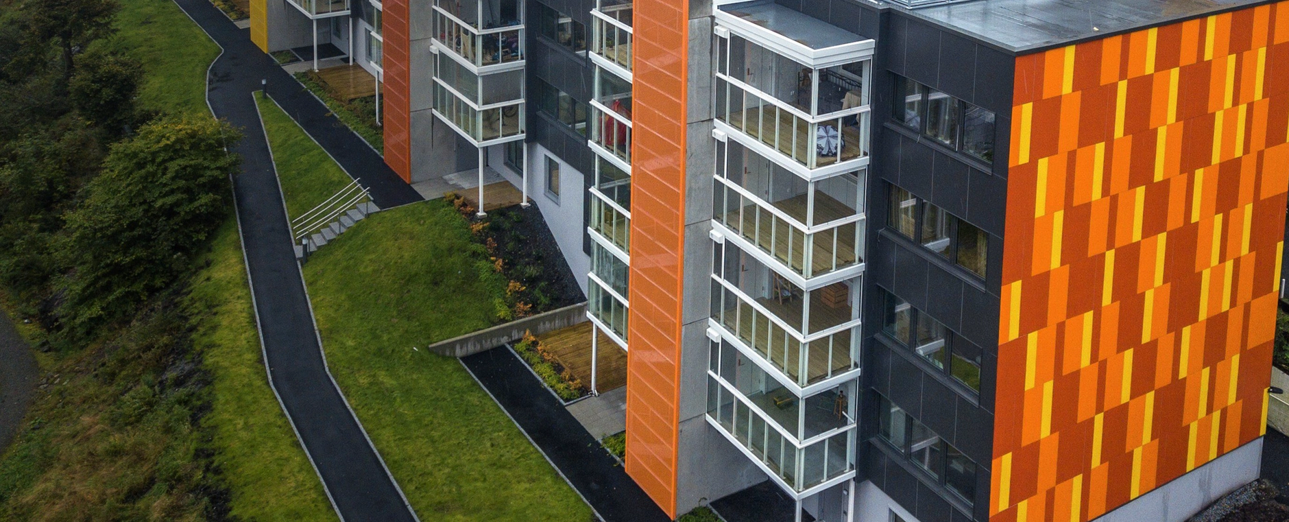 an aerial view of a building with orange and yellow stripes