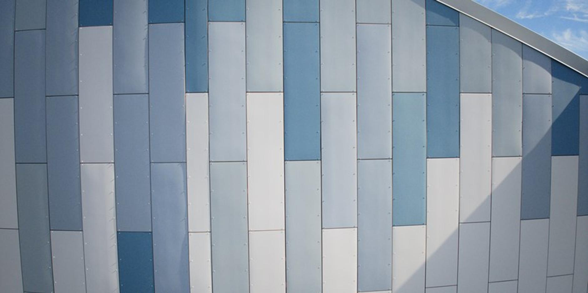 a close up of a blue and white building with a blue sky in the background .