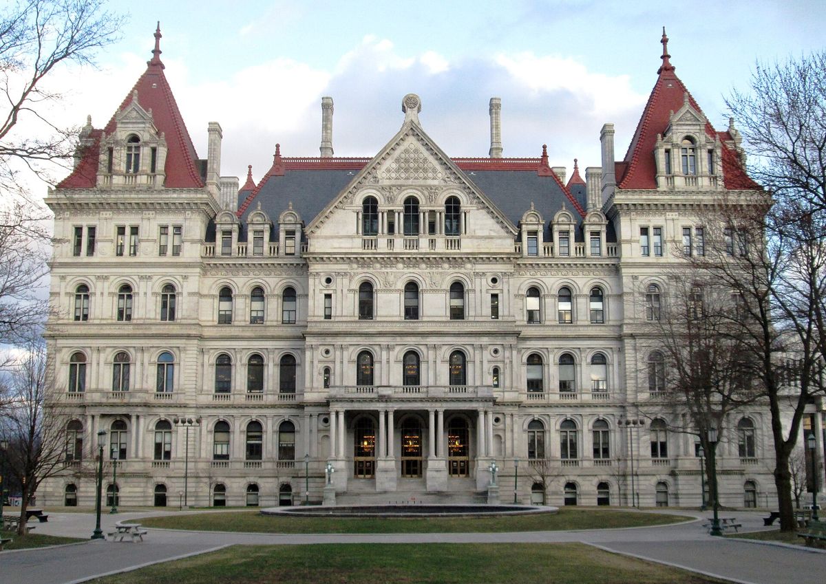 The New York State Capitol in Albany, a granite and sandstone building seen from the northwest, with no figures in the frame.