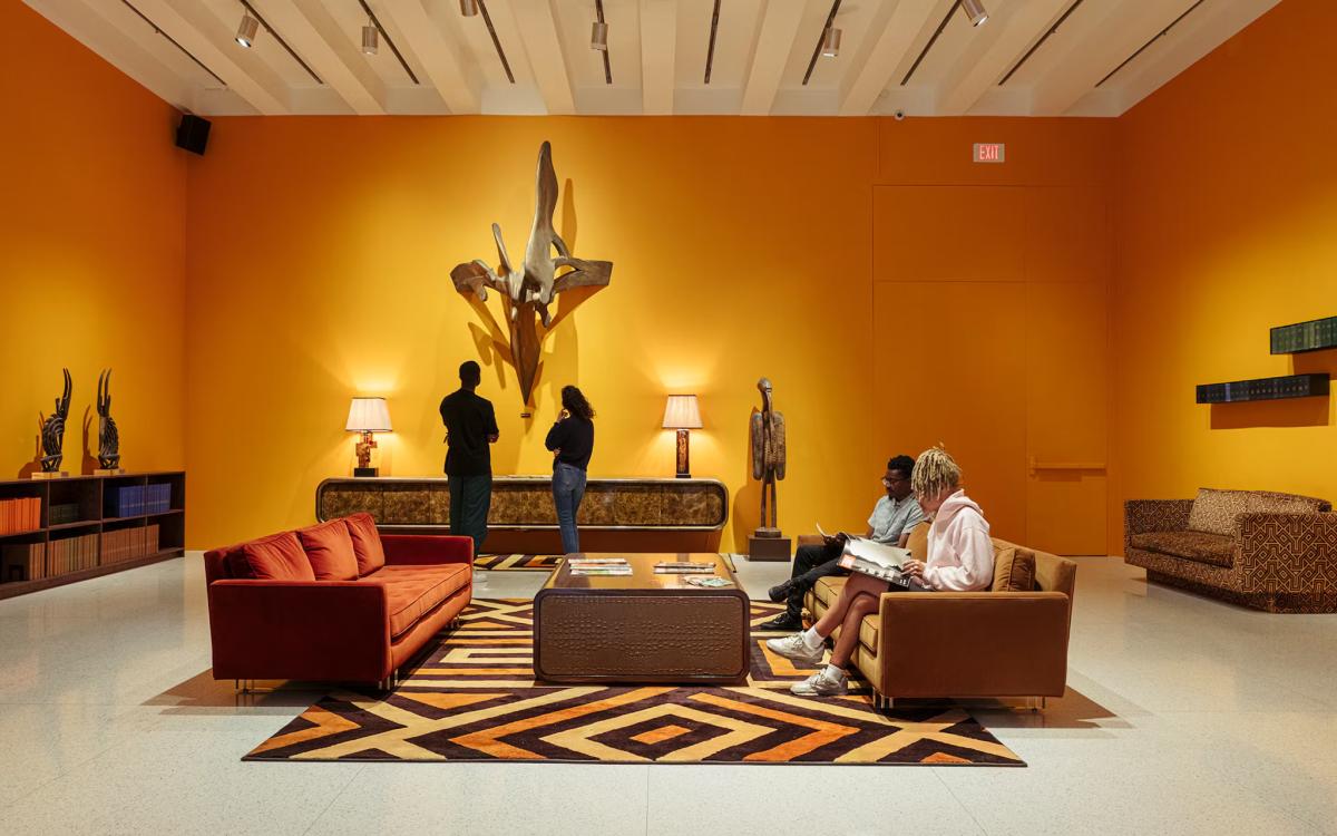  Theaster Gates's  Sanctuary Sounding Board , seen here in an exhibition setting. The work stands as a quiet requiem, a composition of weathered wood that seems to absorb the noise around it, transforming the gallery into a space for memory and contemplation. 