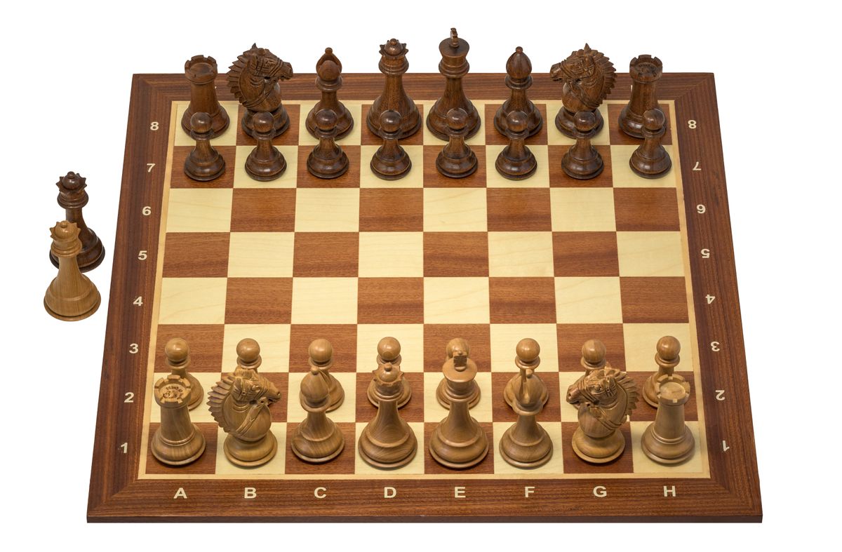 A Staunton pattern chess set on a board