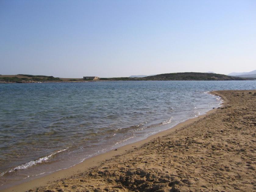 Antiparos beach with turquoise water and rocky shoreline, Cyclades, Greece