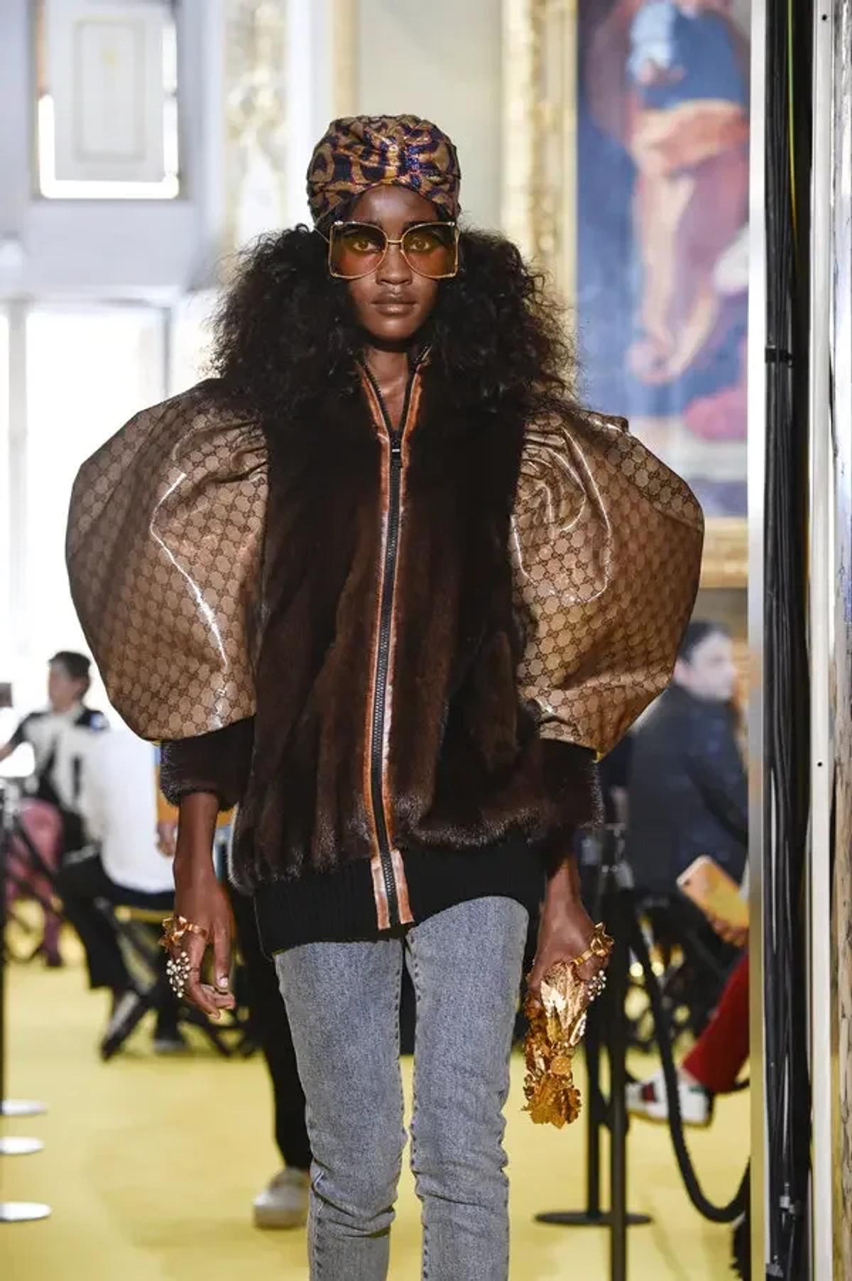  The 'Dapper Dan Paradigm': Gucci's 2017 runway look, a near-identical copy of a 1989 Dapper Dan creation. This act exemplifies the luxury industry's cycle of appropriating 