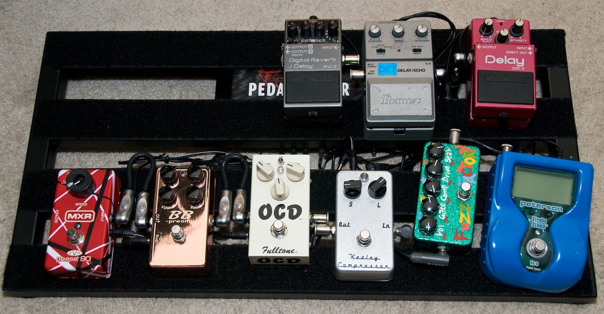 A guitar effects pedalboard packed with stompbox effects units
