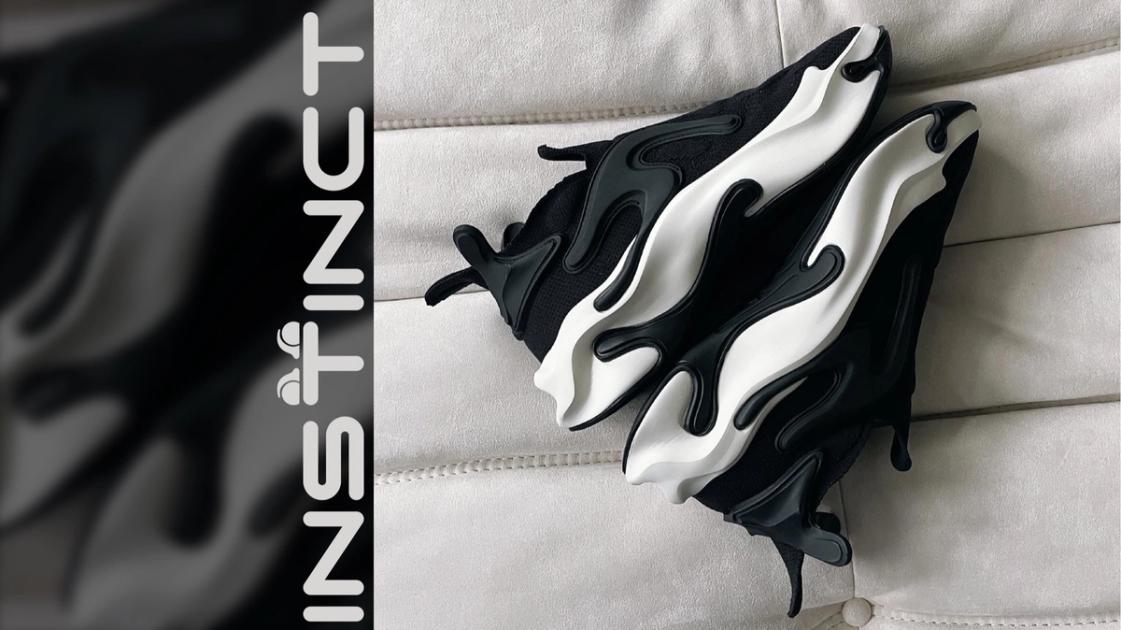 The Khamis Studio Instinct, designed in virtual reality with Gravity Sketch: a black engineered knit upper over a sculpted 3D-printed midsole, the shoe selected for the Future Now museum circuit.