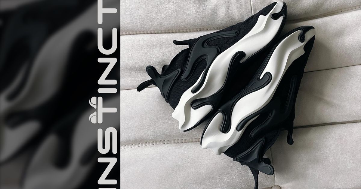The Khamis Studio Instinct, designed in virtual reality with Gravity Sketch: a black engineered knit upper over a sculpted 3D-printed midsole, the shoe selected for the Future Now museum circuit.