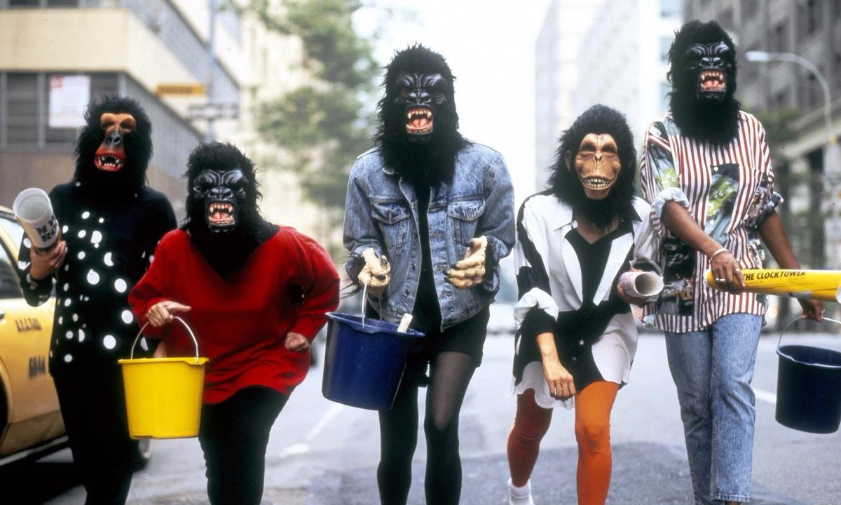 The Guerrilla Girls (1980s-present) demonstrating the power of concealed identities to maintain focus on the issue, art world sexism and racism, rather than the artist, a key precedent for TSH's strategic anonymity.