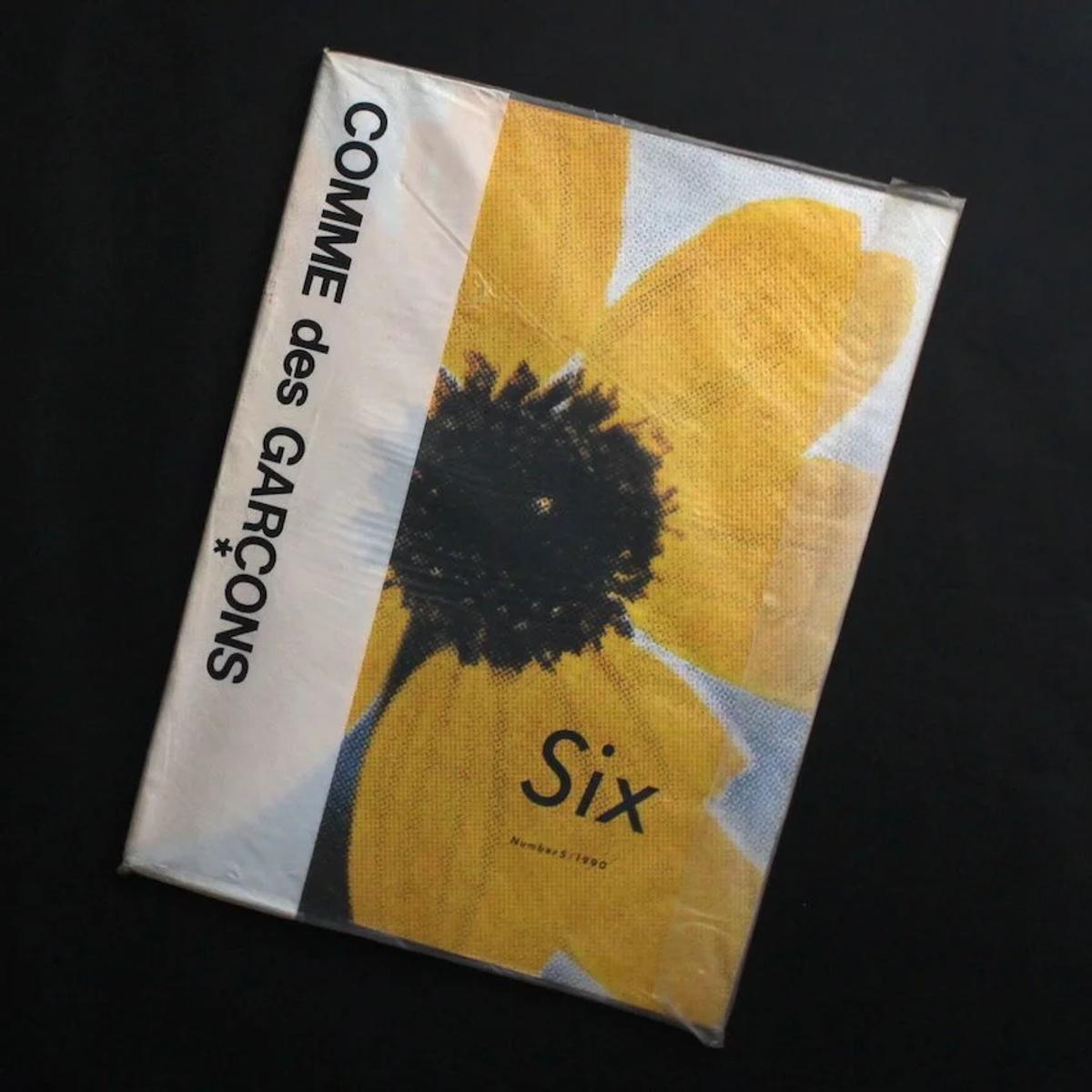 The cover of Six magazine, a publication that famously used few or no words, serves as a powerful expression of Kawakubo's anti-marketing philosophy: a direct refutation of the hyperreal sign of luxury.