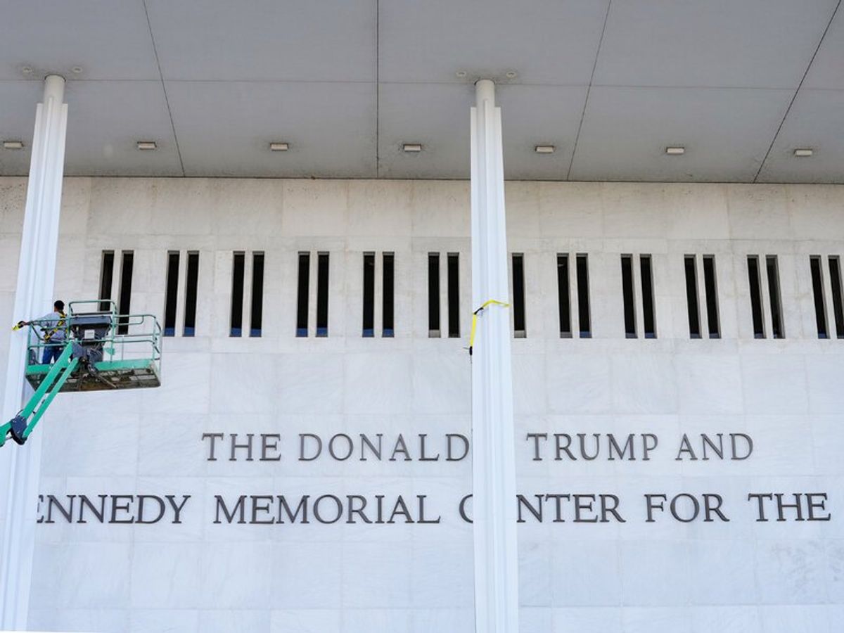 Materializing the Aura Transaction: Workers alter the marble portico of the Edward Durell Stone-designed living memorial. This physical intervention illustrates the nominal grafting analyzed in the PLCFA framework, capturing the temporary structural shift before the May 2026 federal court mandate ordered its removal.