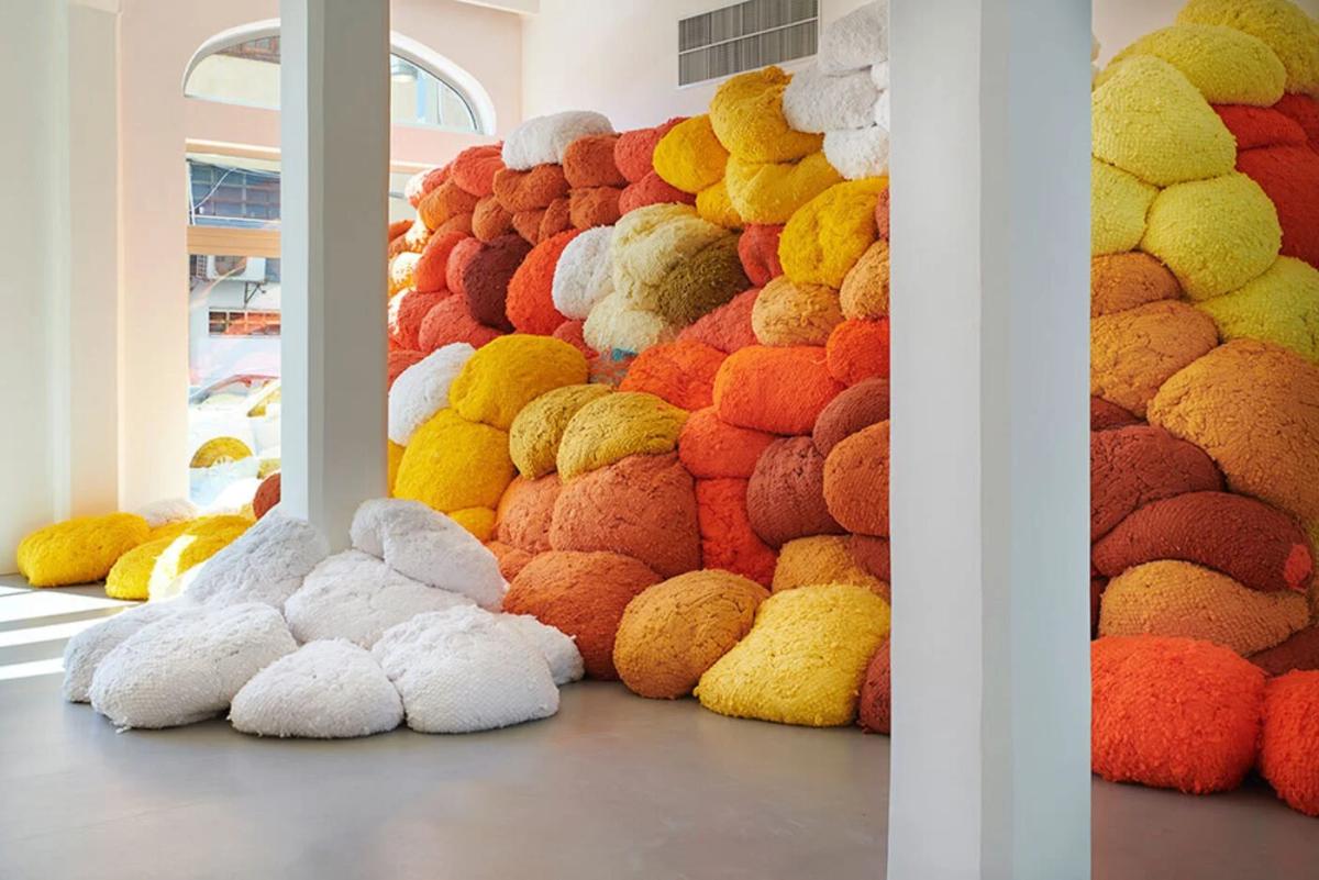  The Architecture of the Thread:  Sheila Hicks’s monumental textile works, such as  Saffron Sentinel , impose Slow Labor upon the viewer. The sheer volume of material and visible texture creates a temporal Fissure, disrupting the instant consumption of the digital image and resisting the velocity of Circulationism. 