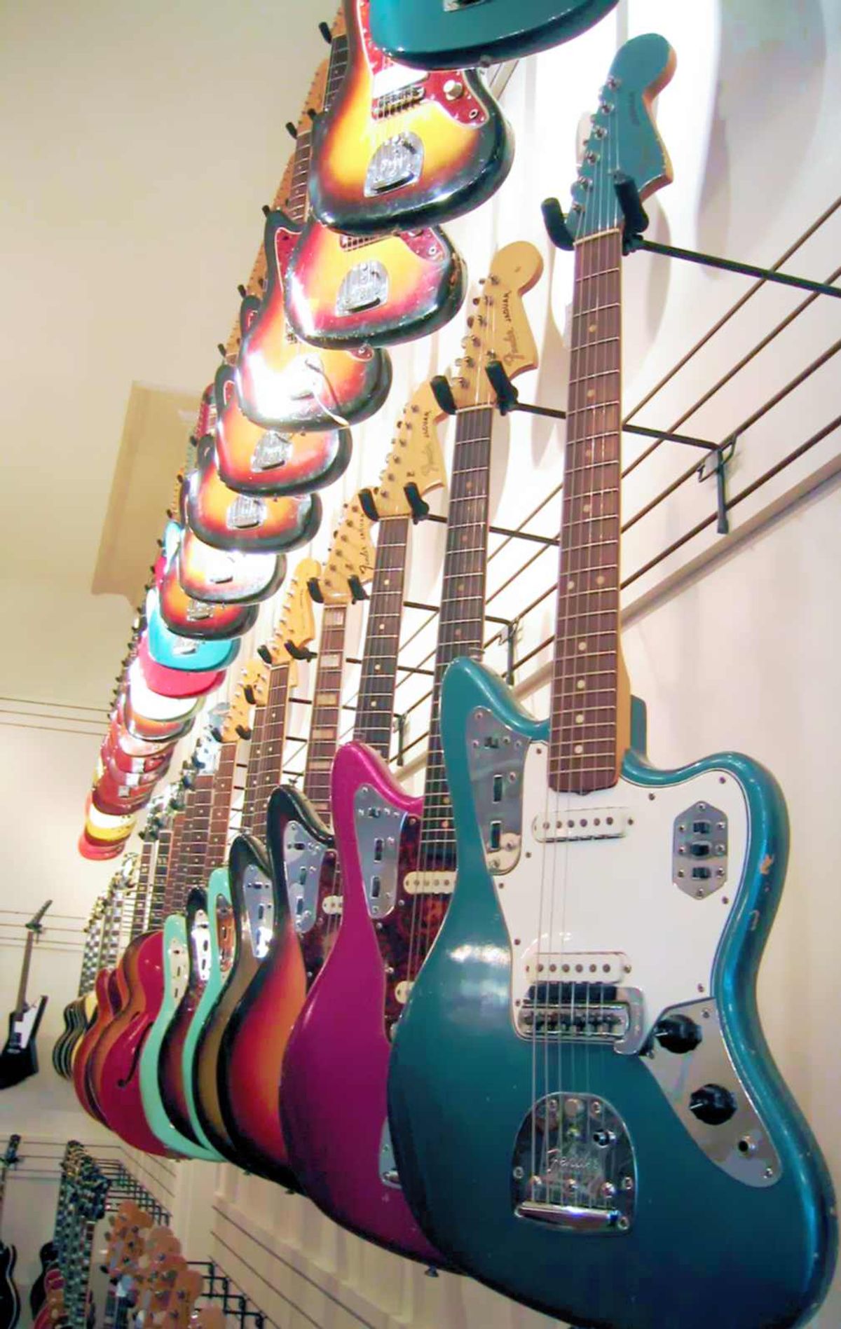 Several Fender Jaguar offset electric guitars