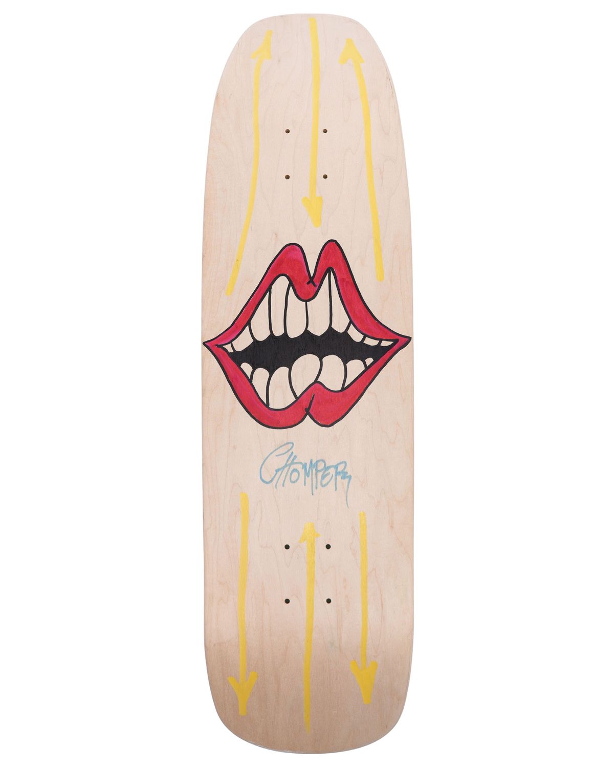 A pale wood skateboard deck painted with a large red-lipped open mouth showing teeth, yellow arrows running top and bottom, and the word Chomper signed in blue below the mouth.