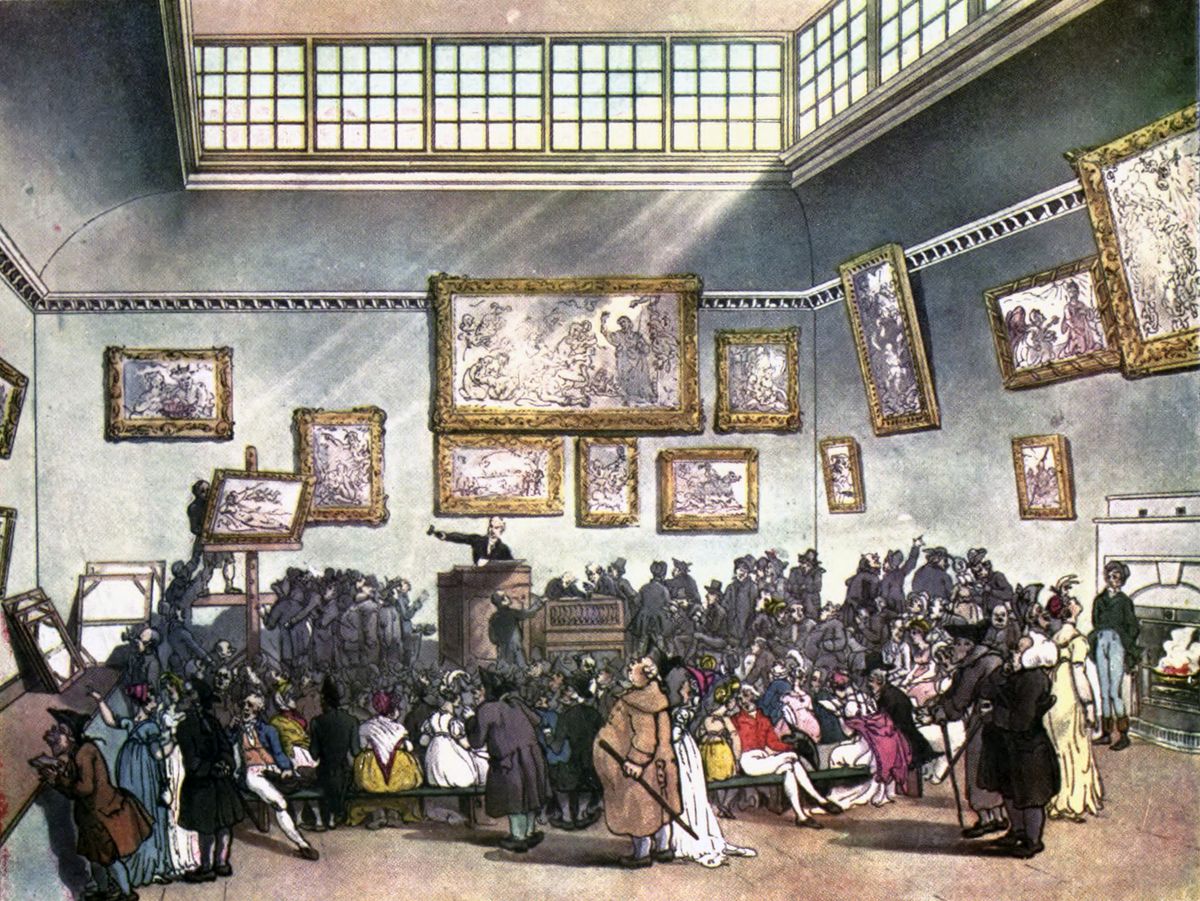 An 1808 hand-coloured aquatint of the auction room at Christie's: a skylit hall hung with framed pictures, an auctioneer at a raised rostrum, and a dense crowd of bidders below.
