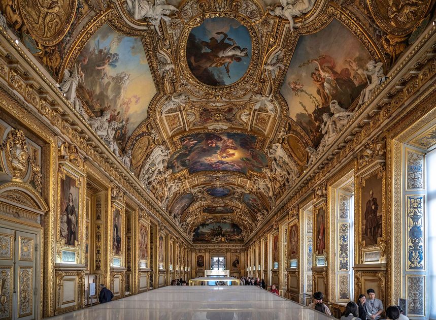 The Galerie d'Apollon at the Louvre, a long barrel-vaulted hall with a painted and gilded ceiling.