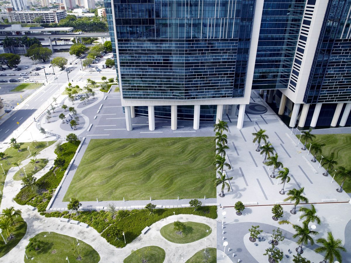 The Wilkie D. Ferguson Junior United States Courthouse in Miami, a tall pale building with lawn and sculpture in front of it.