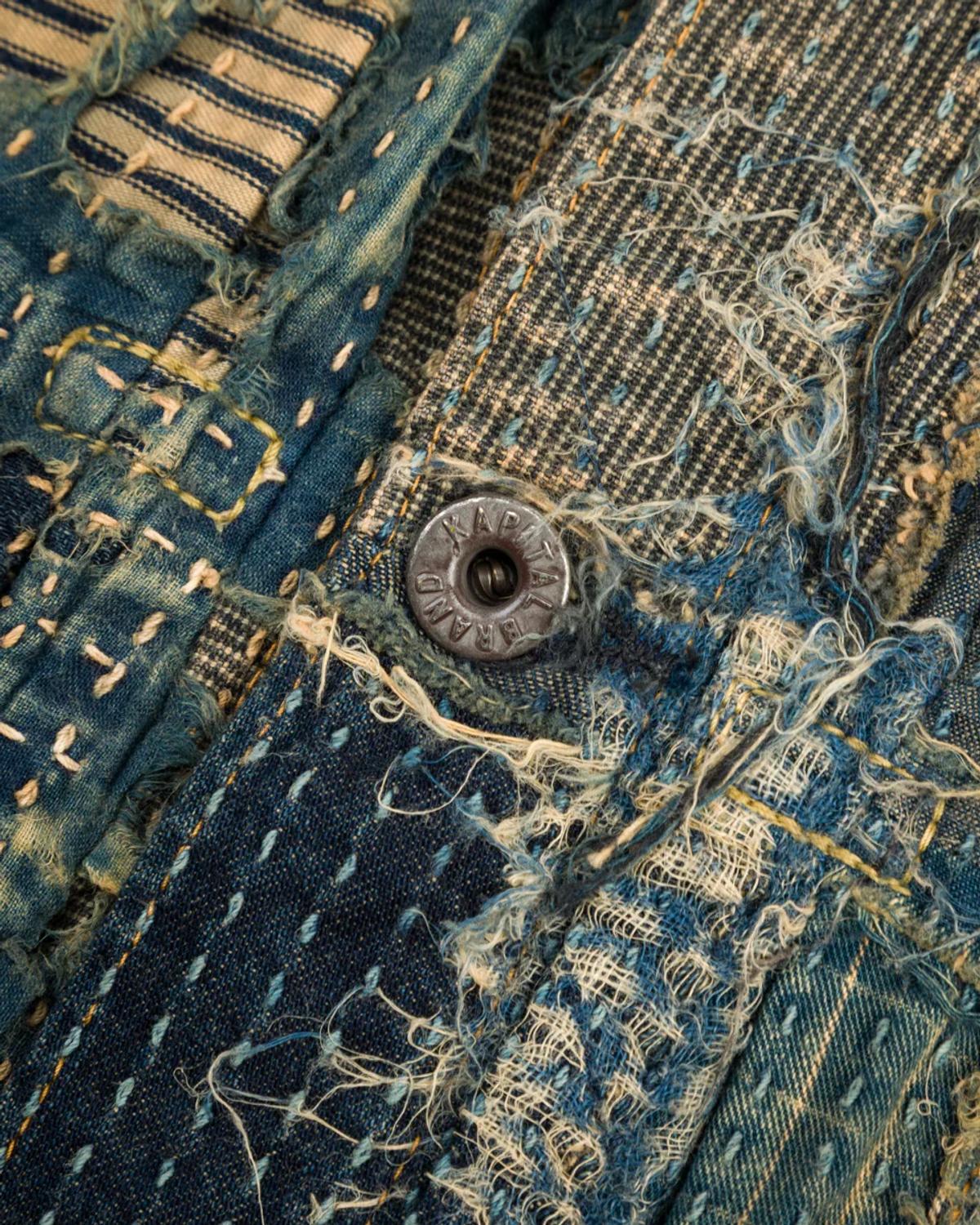This detailed view of a Japanese boro jacket serves as a tangible example of Post-Luxury Conceptual Functional Art. Its value is derived not from a floating signifier or logo, but from its visible narrative of repair, its unique and permanent construction, and the craft of the human hand. It is an object whose meaning deepens with age, an anchor of symbolic exchange in a world of disposable signs.