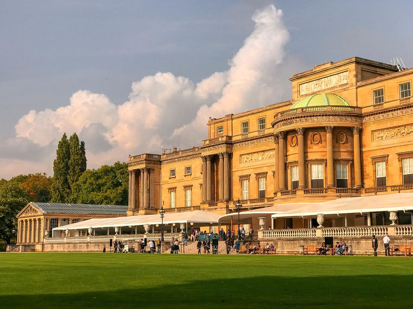 Buckingham Palace rear facade with lawn and visitors, London, where Jonathan Yeo’s oil study of King Charles III is on public view in the Silk Tapestry Room during the 2026 summer season