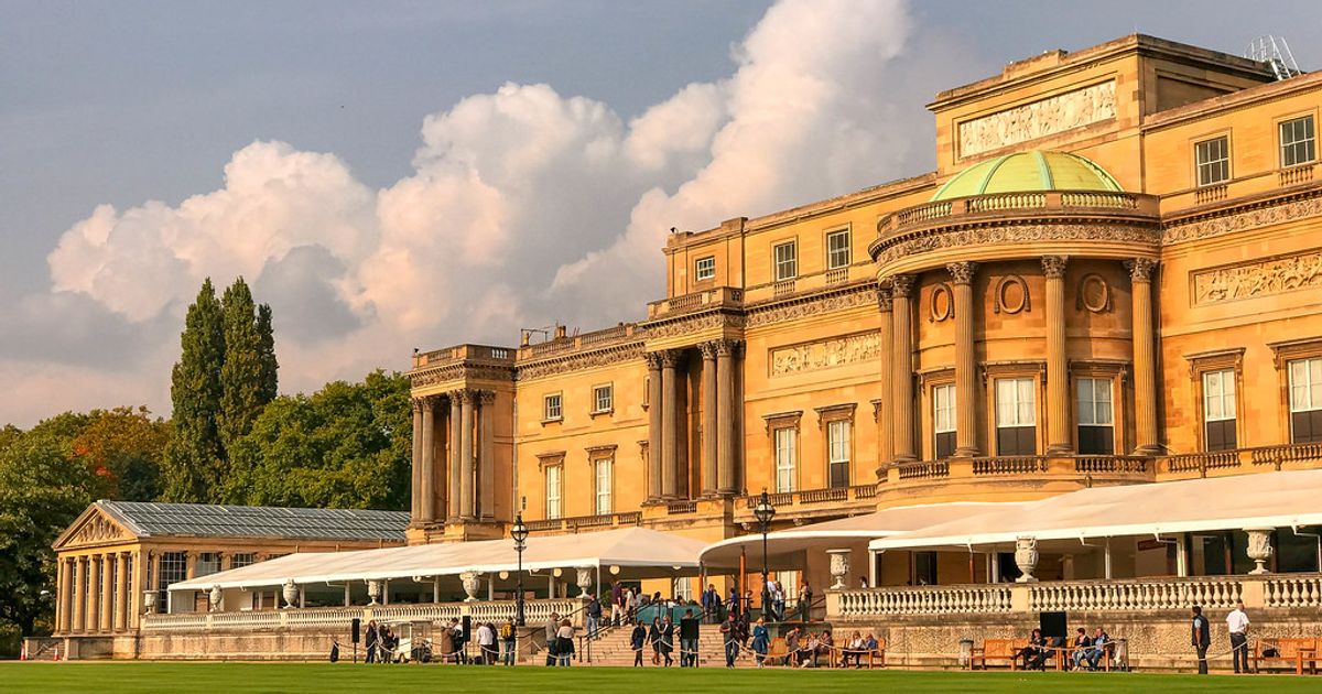Buckingham Palace rear facade with lawn and visitors, London, where Jonathan Yeo’s oil study of King Charles III is on public view in the Silk Tapestry Room during the 2026 summer season