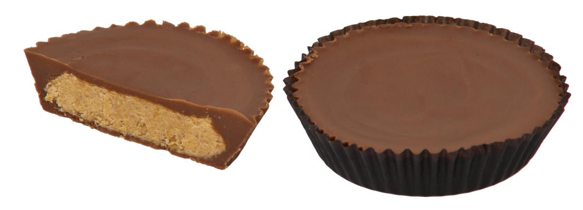 Two peanut butter cups on a plain background, one still in its fluted paper wrapper and the other split in half to show the filling.