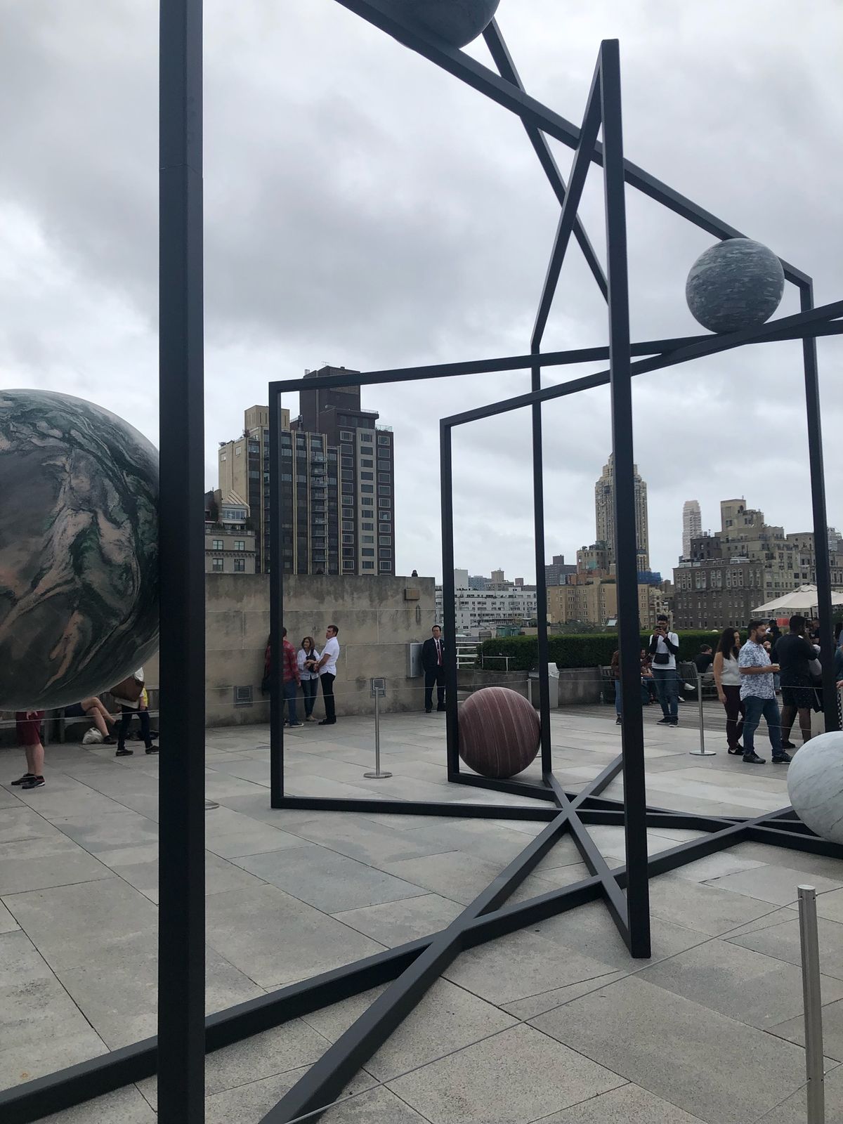 Alicja Kwade's ParaPivot sculpture, stone spheres held in steel frames