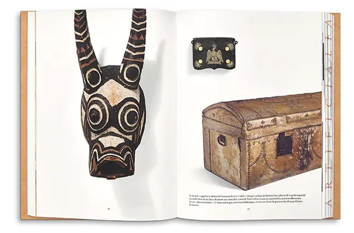 The Architect of Extraction: A page from Cabinet of Wonders displaying a tribal mask from Gaston-Louis Vuitton’s personal collection alongside an LV trunk, illustrating the literal integration of colonial artifacts into the brand's design language.