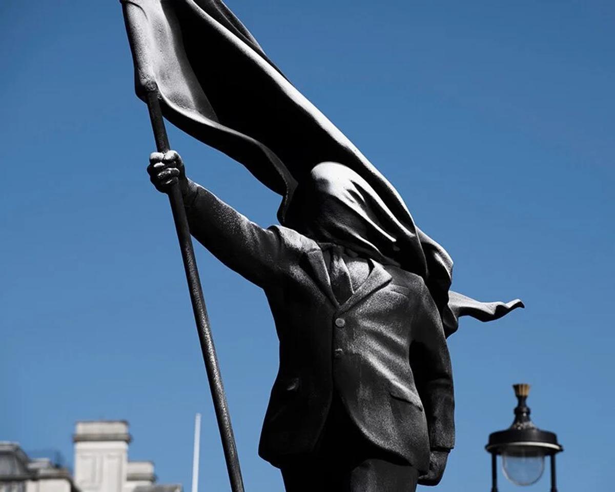   The Suited Void  close up: A flag transition from national symbol to literal architecture of blindness. 