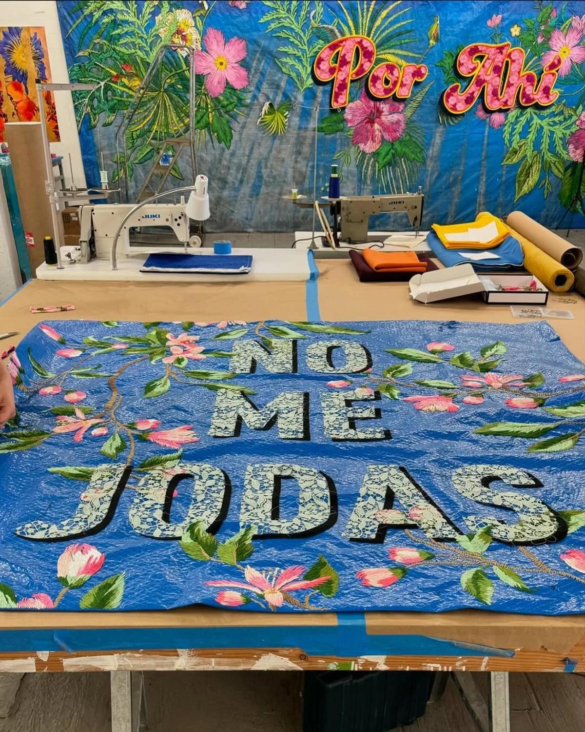 The Process as Healing (The Anti-White Cube): Rolón's transformation of the utilitarian blue tarp into a complex, embroidered masterpiece is a foundational act of Artisan Activism, preserving the material’s scars and ensuring its Provenance Integrity is prioritized over Aesthetic Neutrality.