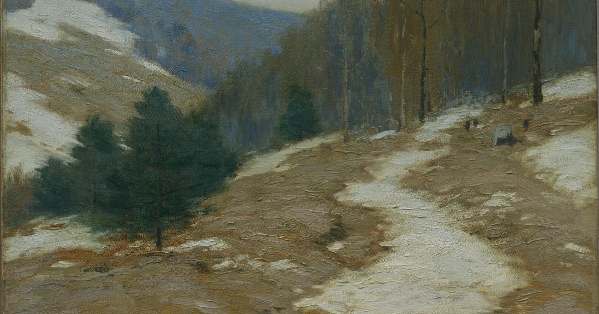 A tonal winter landscape in greys and browns, snow lying in patches on a hillside with bare trees along a ridge, signed in the lower right corner.